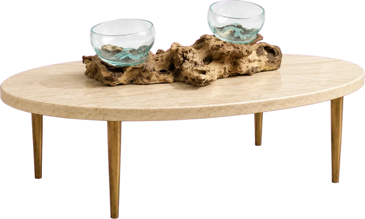 Deux coupes en verre soufflé posées sur une longue racine de Gamal, sur une table basse ovale en pierre claire à pieds laiton